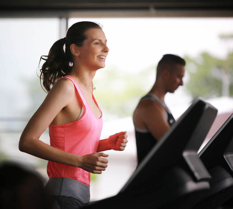 sport, fitness, lifestyle and people concept - group of men flexing muscles with dumbbells in gym